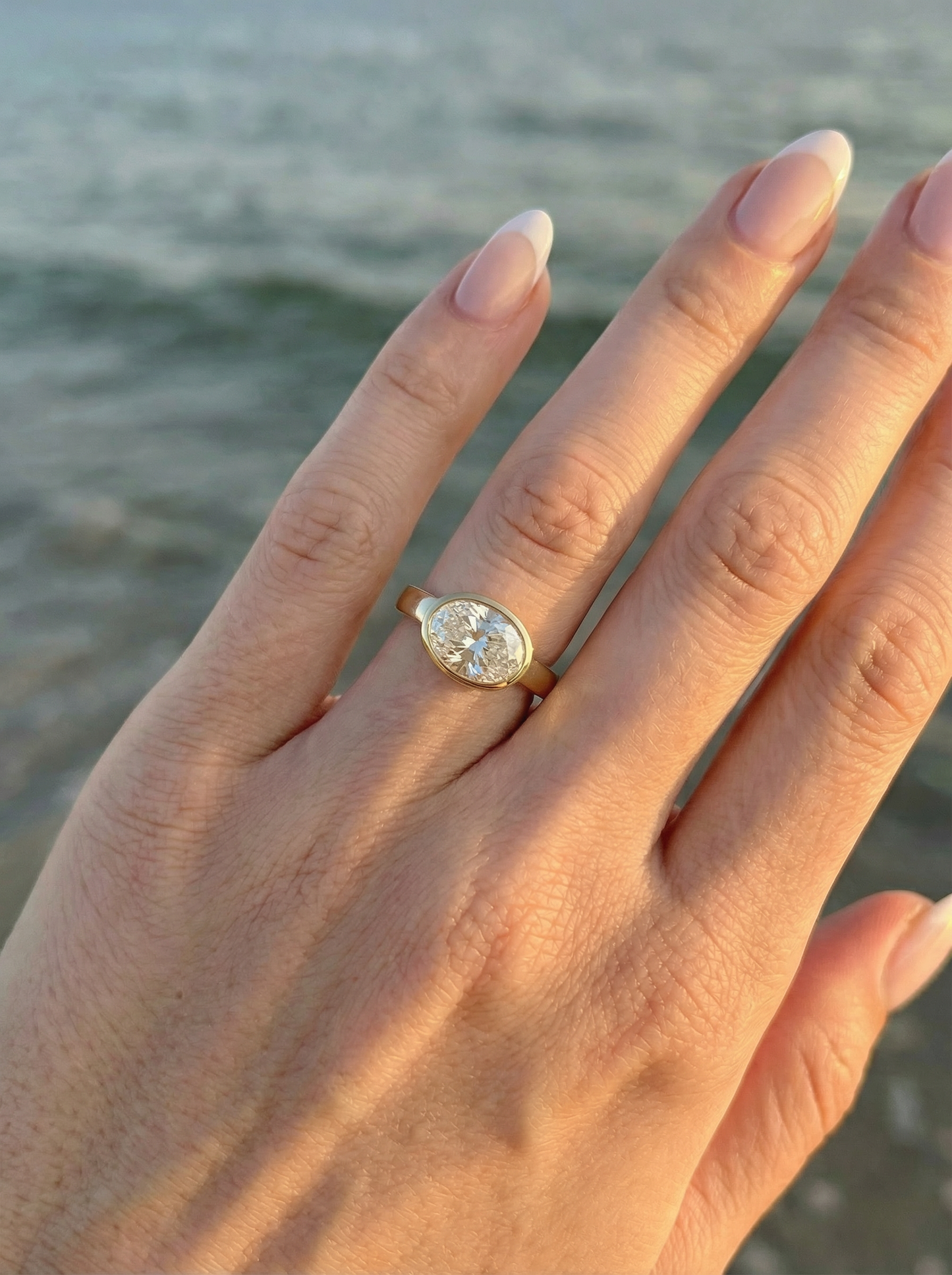 East West Bezel Oval Solitaire Moissanite Engagement Ring