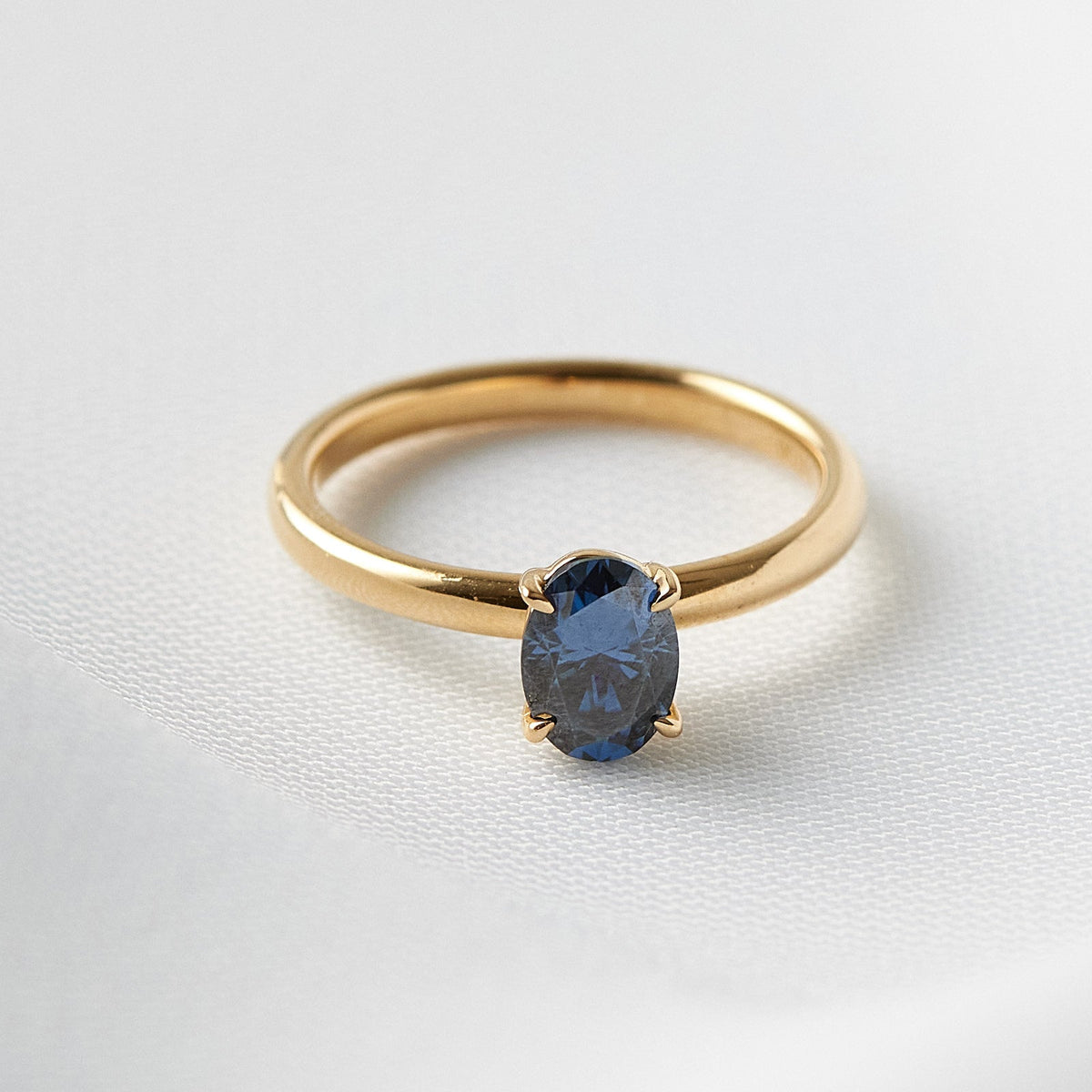 Oval Blue Solitaire Engagement Ring