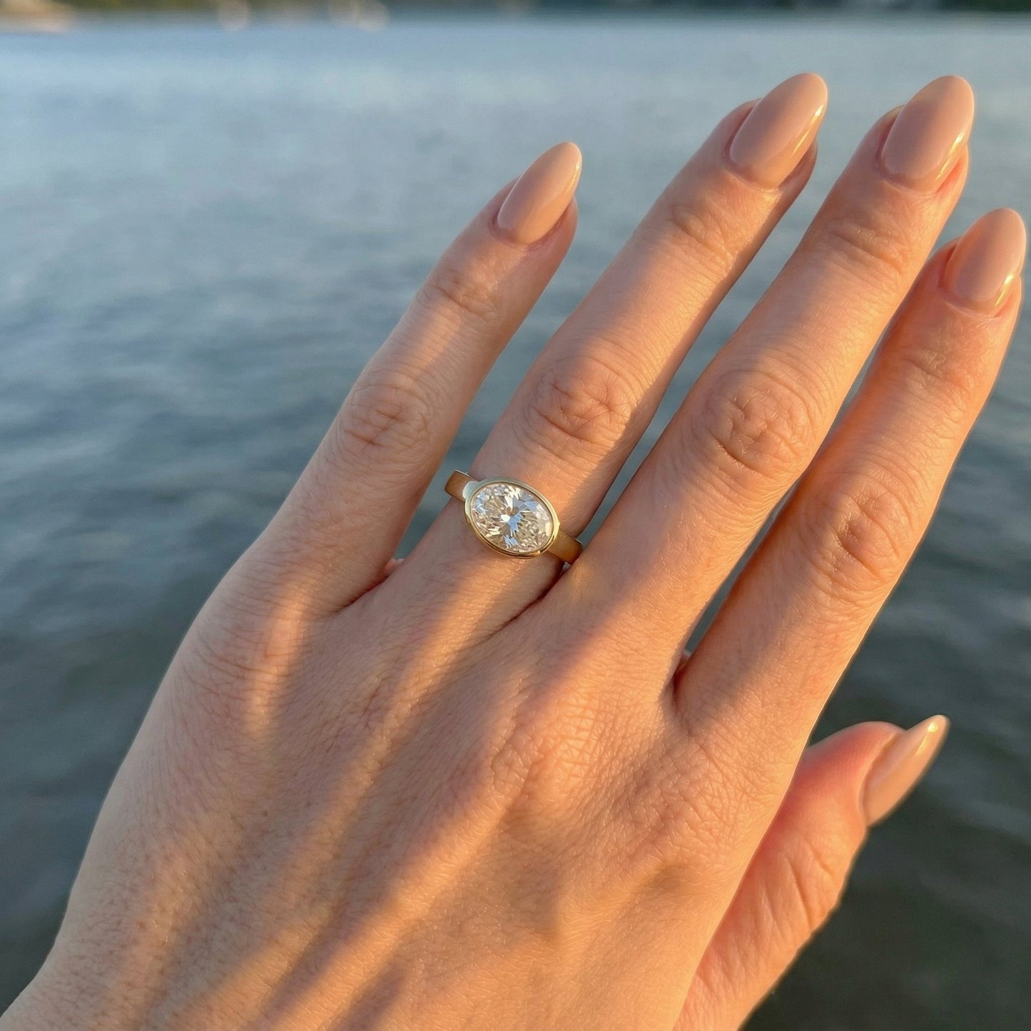 East West Bezel Oval Solitaire Moissanite Engagement Ring