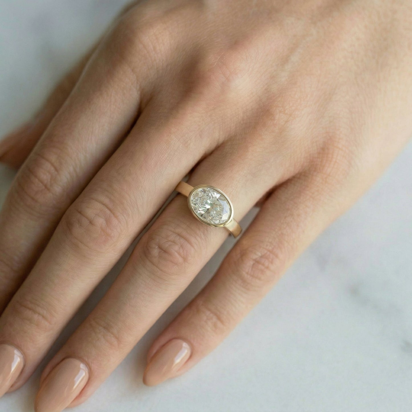 East West Bezel Oval Solitaire Moissanite Engagement Ring