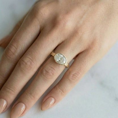 East West Bezel Oval Solitaire Moissanite Engagement Ring