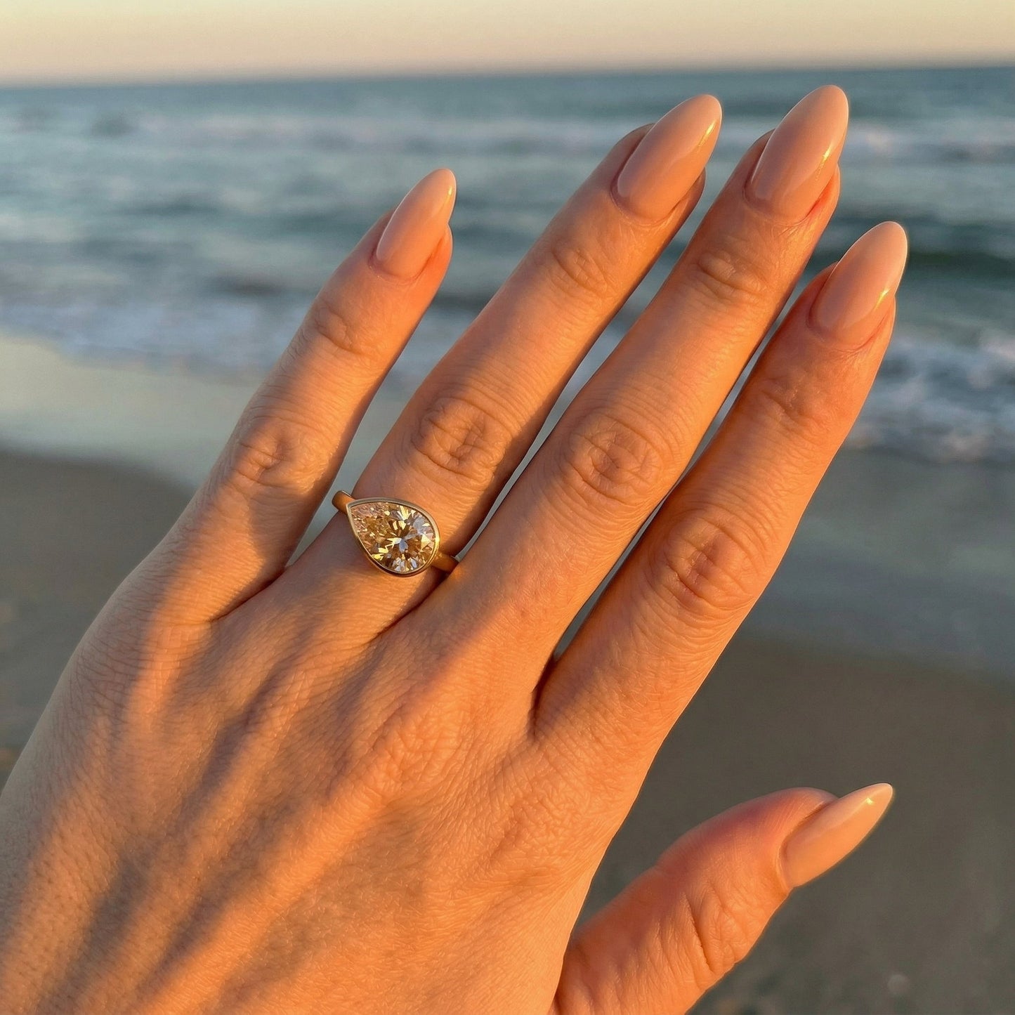 East West Bezel Pear Solitaire Moissanite Engagement Ring