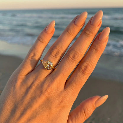 East West Bezel Pear Solitaire Moissanite Engagement Ring