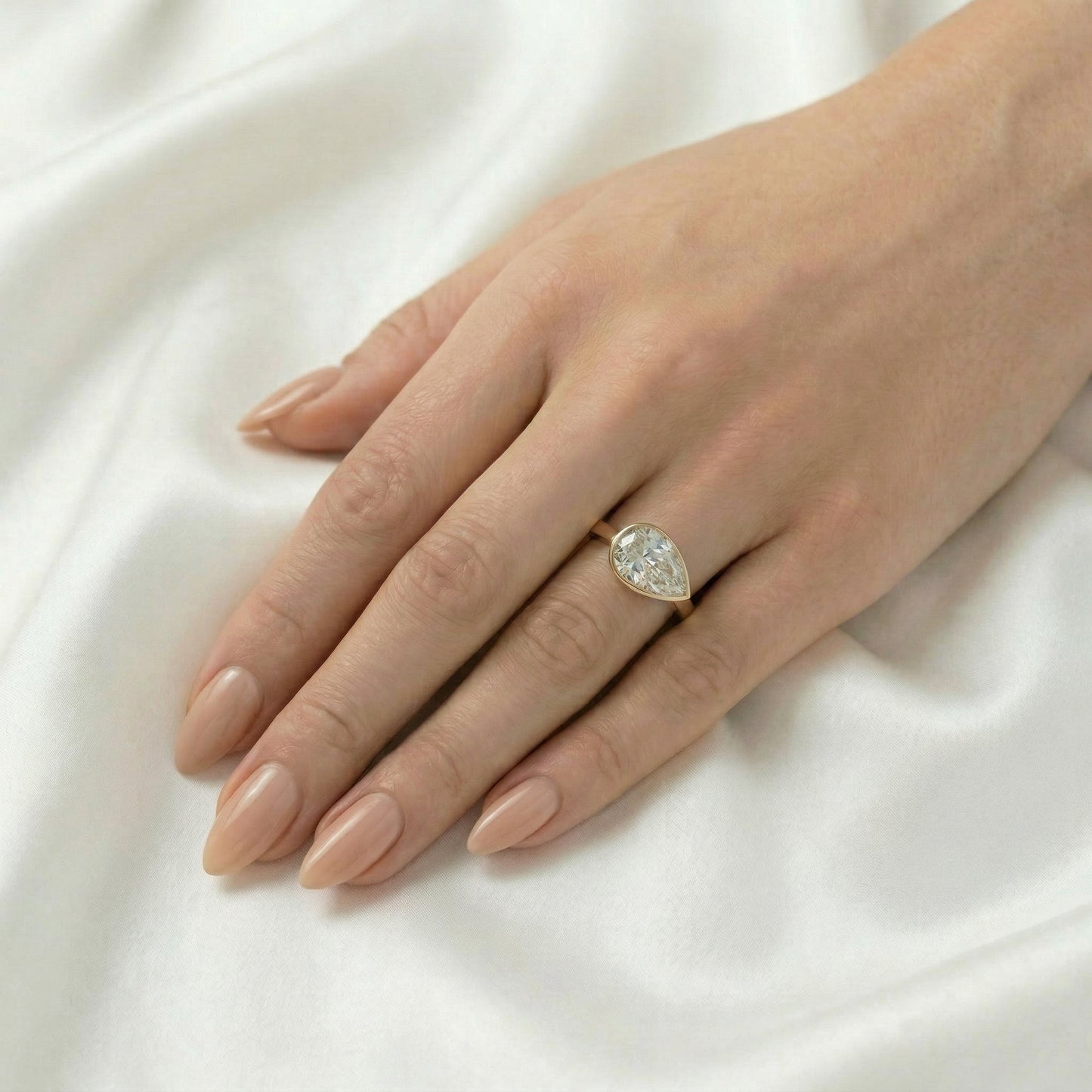 East West Bezel Pear Solitaire Moissanite Engagement Ring