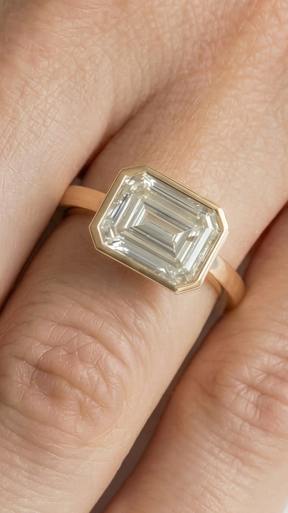 East West Bezel Emerald Solitaire Moissanite Engagement Ring