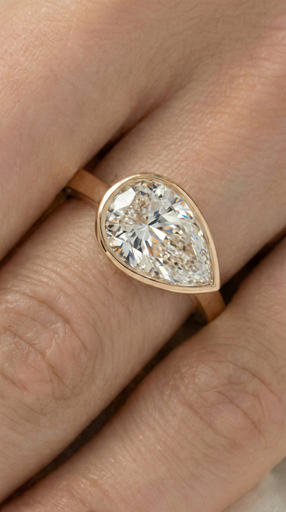 East West Bezel Pear Solitaire Moissanite Engagement Ring