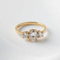 Iris — Oval Trilogy Round Setting Moissanite Engagement Ring
