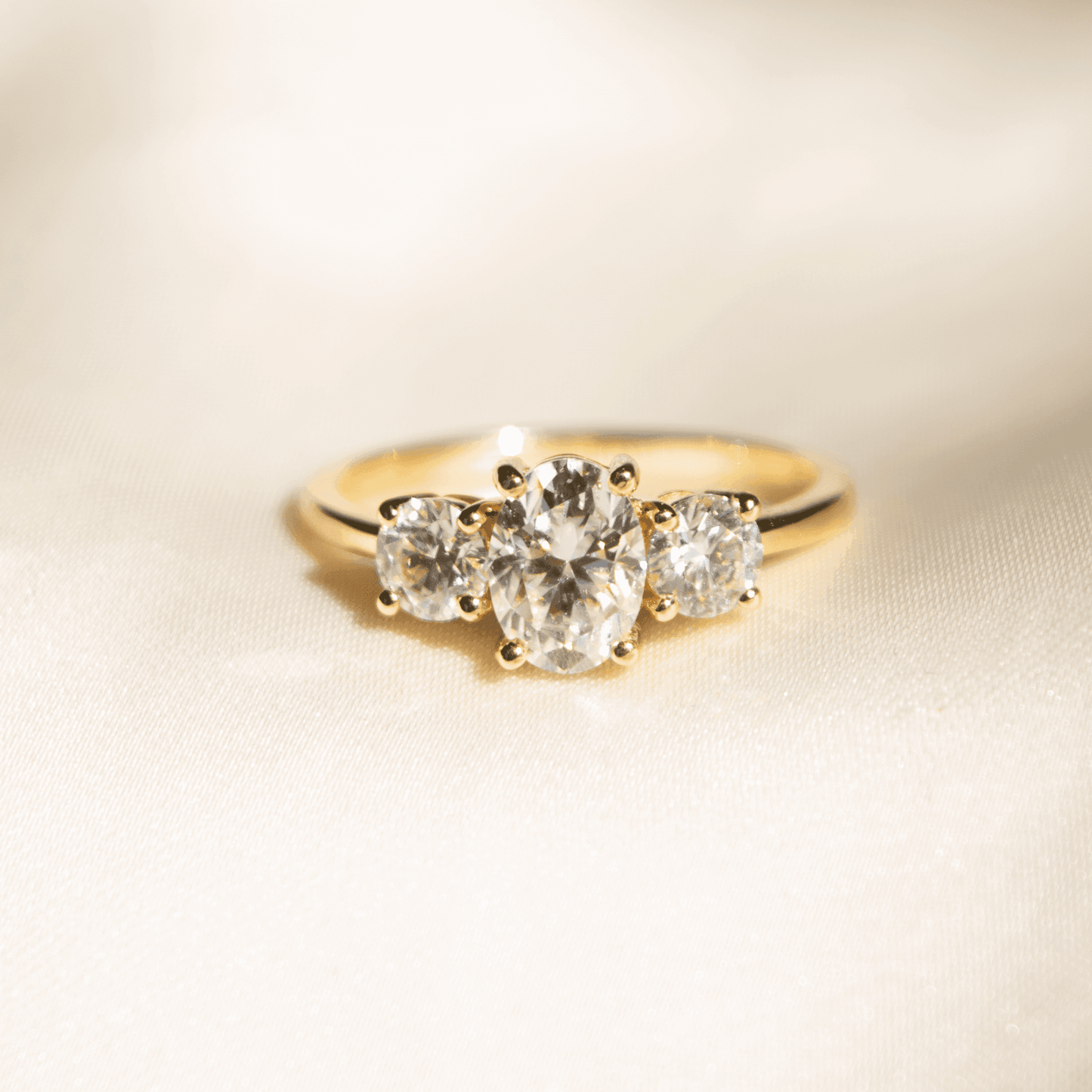 Oval Trilogy Round Setting Diamond Engagement Ring - Moissanite Engagement Rings